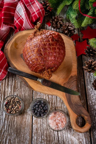 stock image Baked ham on a cutting board. Shallow depth of field.