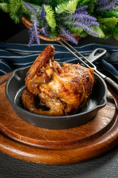 Roasted chicken served in vintage cast iron skillet.