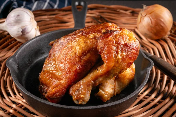 Roasted chicken served in vintage cast iron skillet.