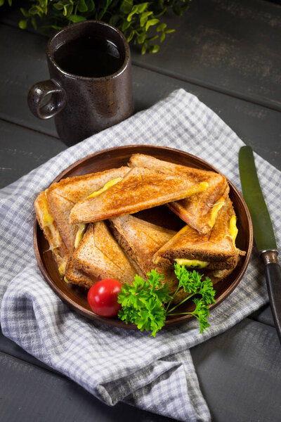 Grilled cheese sandwich on plate. Shallow depth of field.