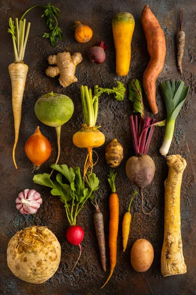 Fresh root vegetables on textured background. Autumn harvest. Concept healthy food.