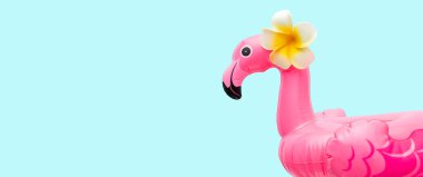 Pink flamingo on light background. Summer beach party concept. Flat lay, copy space.