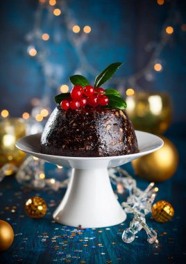 Christmas pudding decorated with holly clipart