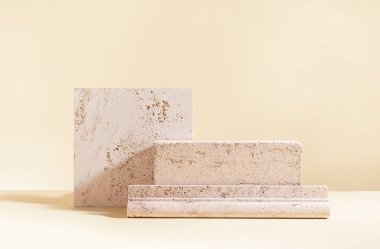 Abstract modern still life. Natural materials. Composition of travertine and concrete blocks.