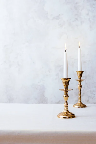 Cozy Still Life Burning Candles Golden Candlesticks Pastel Light Background Royalty Free Stock Images