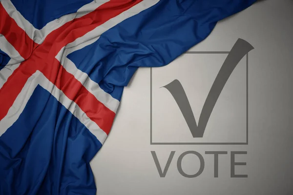 Махаючи Барвистим Національним Прапором Ісландії Сірому Фоні Текстовим Голосуванням Концепція — стокове фото