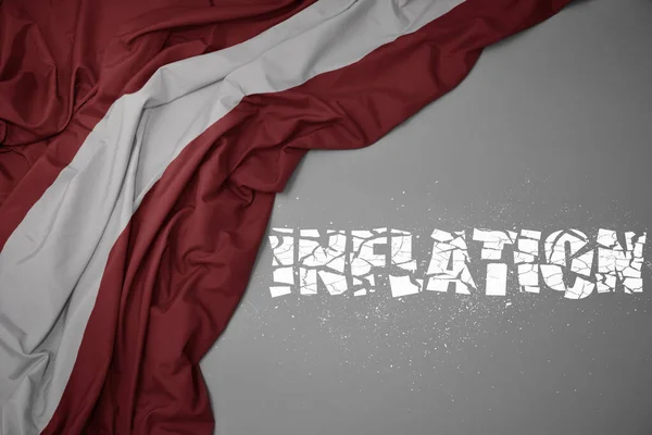 Acenando Bandeira Nacional Colorida Latvia Fundo Cinza Com Inflação Texto — Fotografia de Stock