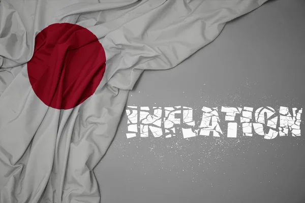 Acenando Bandeira Nacional Colorida Japão Fundo Cinza Com Inflação Texto — Fotografia de Stock