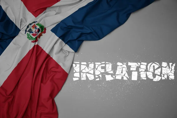 Machanie Barwną Flagą Narodową Republiki Dominikańskiej Szarym Tle Zepsutą Inflacją — Zdjęcie stockowe