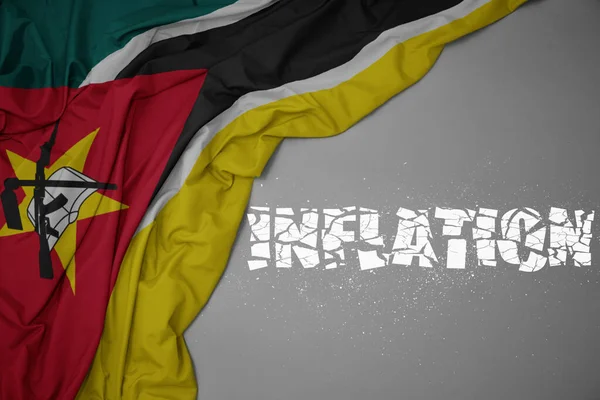 Waving Colorful National Flag Mozambique Gray Background Broken Text Inflation — Stock Photo, Image