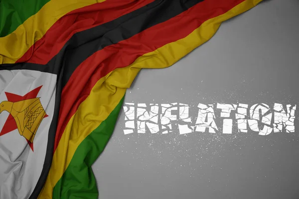 Acenando Bandeira Nacional Colorida Zimbabwe Fundo Cinza Com Inflação Texto — Fotografia de Stock