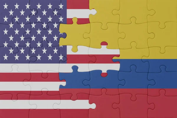 stock image puzzle with the national flag of colombia and united states of america. macro.concept. 3d illustration