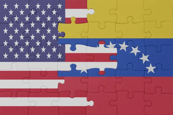 stock image puzzle with the national flag of venezuela and united states of america. macro.concept. 3d illustration