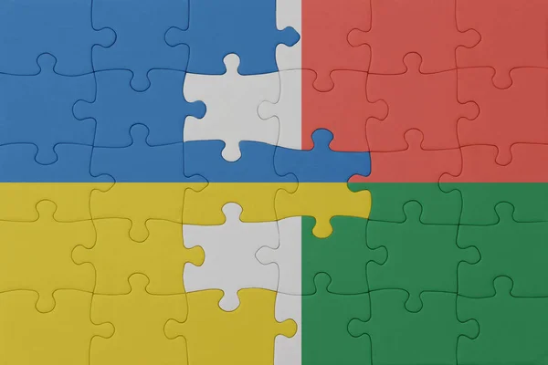 Puzzel Met Nationale Vlag Van Ukraine Madagascar Macro Concept Illustratie — Stockfoto