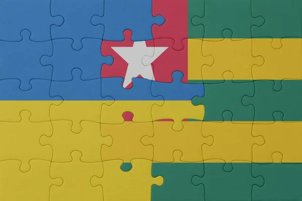Puzzle Mit Der Nationalflagge Der Ukraine Und Togos Macro Concept — Stockfoto