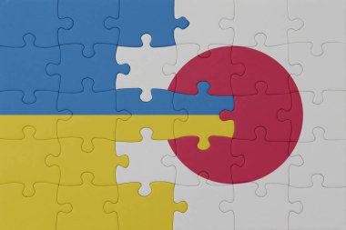 Ukrayna ve Japonya 'nın ulusal bayrağıyla bulmaca. Makro. Kavram. 3d illüstrasyon
