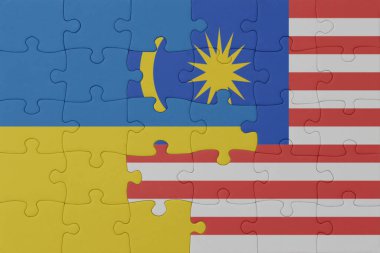 Ukrayna ve Malezya 'nın ulusal bayrağıyla bulmaca. Makro. Kavram. 3d illüstrasyon