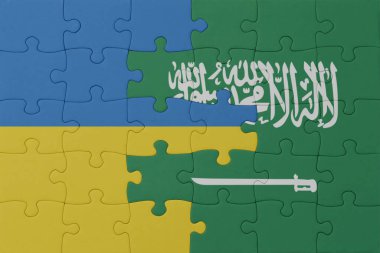 Ukrayna ve Suudi Arabistan 'ın ulusal bayrağıyla bulmaca. Makro. Kavram. 3d illüstrasyon