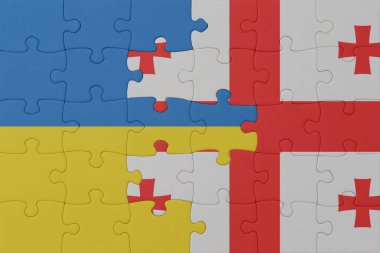 Ukrayna ve Gürcistan 'ın ulusal bayrağıyla bulmaca. Makro. Kavram. 3d illüstrasyon