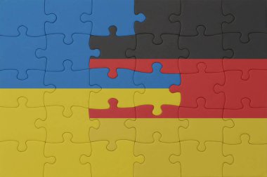 Ukrayna ve Almanya 'nın ulusal bayrağıyla bulmaca. Makro. Kavram. 3d illüstrasyon