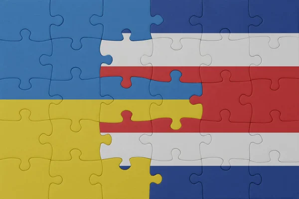 Puzzle Mit Der Nationalflagge Der Ukraine Und Costa Ricas Macro — Stockfoto