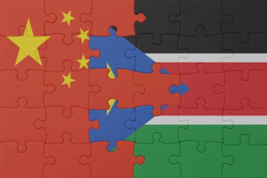 Güney Sudan ve Çin 'in ulusal bayrağıyla bulmaca. Makro. Kavram. 3d illüstrasyon