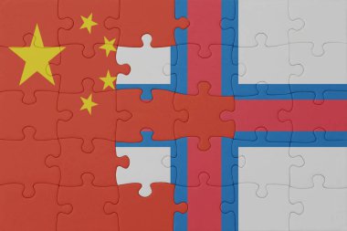 Faroe Adaları ve Çin 'in ulusal bayrağıyla bulmaca. Makro. Kavram. 3d illüstrasyon