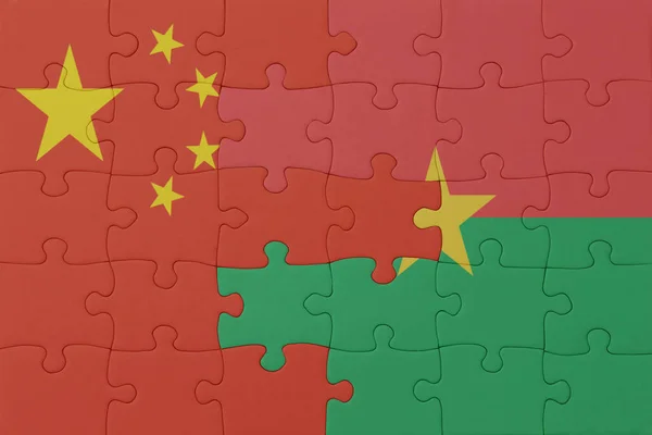 ブルキナ ファソと中国の国旗のパズルです マクロ コンセプト 3Dイラスト — ストック写真
