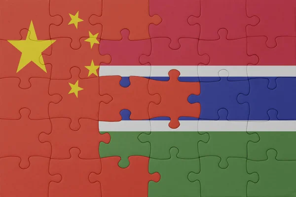 stock image puzzle with the national flag of gambia and china . macro.concept. 3d illustration