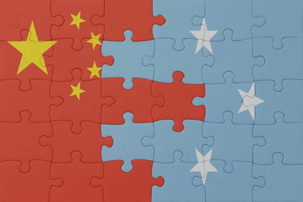 ミクロネシア連邦と中国の国旗のパズルです マクロ コンセプト 3Dイラスト — ストック写真