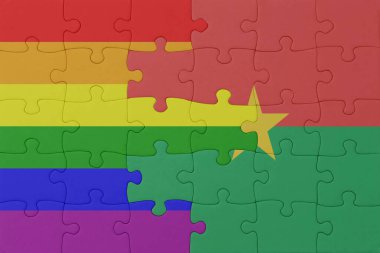 Gökkuşağı bayrağı eşcinsellik gururu ve Burkina faso 'nun bulmacası. Makro. Kavram. 3d illüstrasyon