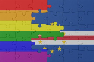 Gökkuşağı bayrağı eşcinsellik gururu ve pelerin verdesiyle bulmaca. Makro. Kavram. 3d illüstrasyon