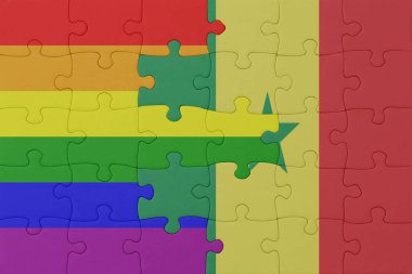 Gökkuşağı bayrağı eşcinsellik gururu ve senegal bulmacası. Makro. Kavram. 3d illüstrasyon