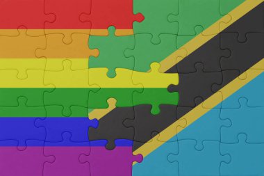 Gökkuşağı bayrağı eşcinsellik gururu ve tanzanya ile bulmaca. Makro. Kavram. 3d illüstrasyon