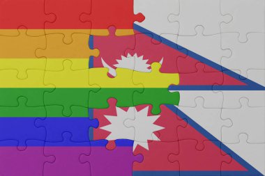 Gökkuşağı bayrağı eşcinsellik gururu ve nepal ile bulmaca. Makro. Kavram. 3d illüstrasyon