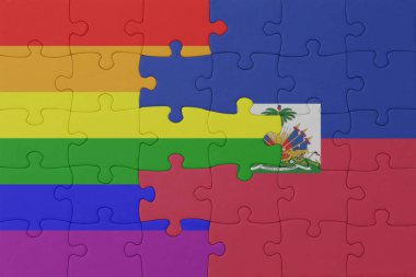 Gökkuşağı bayrağı eşcinsellik gururu ve haiti ile bulmaca. Makro. Kavram. 3d illüstrasyon