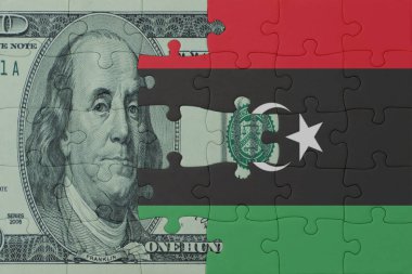 Ulusal Libya bayrağı ve dolar banknotuyla ilgili bulmacalar. Makro. Kavram. 3d illüstrasyon