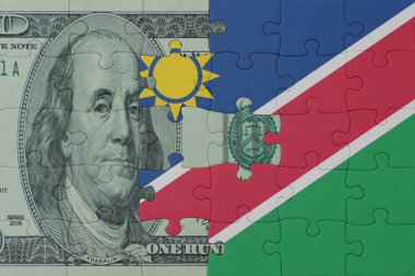 Namibya bayrağı ve dolar banknotuyla ilgili bulmacalar. Makro. Kavram. 3d illüstrasyon