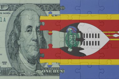 Eswatini 'nin ulusal bayrağı ve dolar banknotunun bulmacası. Makro. Kavram. 3d illüstrasyon
