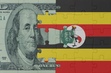 Ulusal Uganda bayrağı ve dolar banknotları bulmacası. Makro. Kavram. 3d illüstrasyon