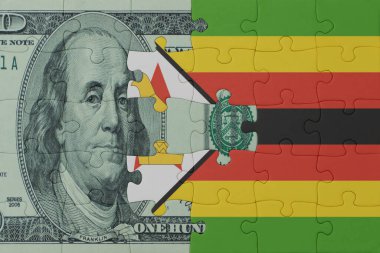 Ulusal Zimbabwe bayrağı ve dolar banknotuyla bulmaca. Makro. Kavram. 3d illüstrasyon