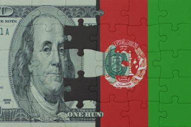 Afganistan 'ın ulusal bayrağı ve dolar banknotunun bulmacası. Makro. Kavram. 3d illüstrasyon