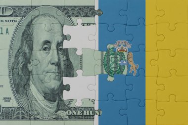 Ulusal kanarya adaları bayrağı ve dolar banknotları bulmacası. Makro. Kavram. 3d illüstrasyon