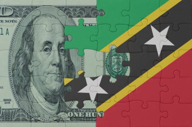 Ulusal Aziz Kitts ve Nevis bayrağı ve dolar banknotları bulmacası. Makro. Kavram. 3d illüstrasyon