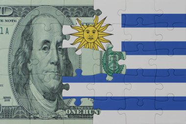 Uruguay 'ın ulusal bayrağı ve dolar banknotunun bulmacası. Makro. Kavram. 3d illüstrasyon