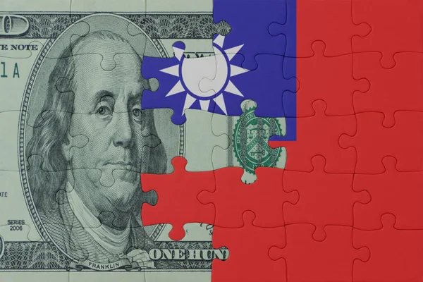 puzzle with the national flag of taiwan and dollar money banknote. macro.concept. 3d illustration