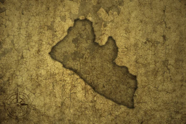 古いヴィンテージのクラック紙の背景にリベリアの地図 3Dイラスト — ストック写真