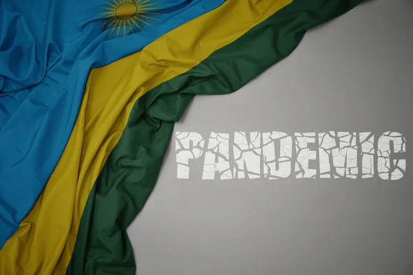 灰色の背景にルワンダのカラフルな国旗を振りかけました コンセプト 3Dイラスト — ストック写真