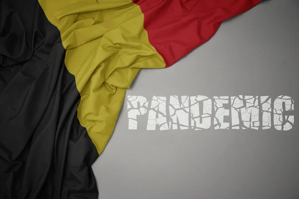 灰色の背景にベルギーのカラフルな国旗を振りかけました コンセプト 3Dイラスト — ストック写真