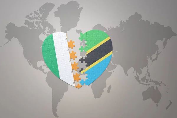 puzzle heart with the national flag of tanzania and ireland on a world map background.Concept. 3D illustration
